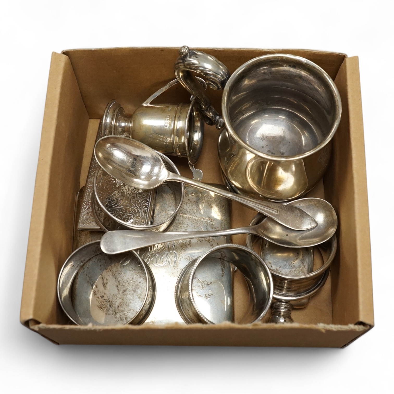 A George V small silver baluster mug, William Neale Ltd, Birmingham, 1928, 81mm, together with a silver cigarette case, a small silver scent flask, a silver card case, a small silver two handled trophy cup, four silver n